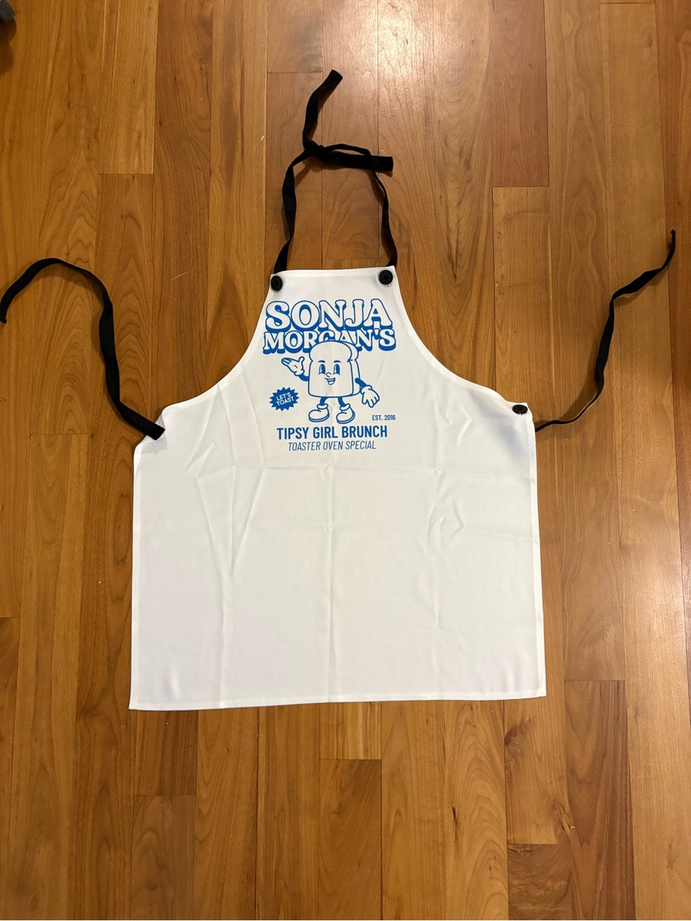 Bravo Real Housewives White Apron with Blue Sonia Morgan's Logo
